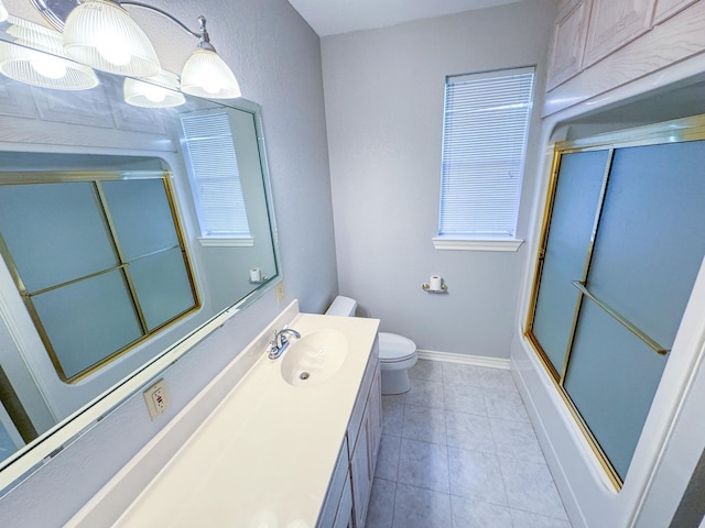 full bathroom with oversized vanity, enclosed tub / shower combo, toilet, and tile flooring