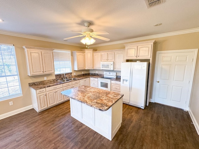 kitchen with dark hardwood / wood-style flooring, white appliances, a center island, and ceiling fan