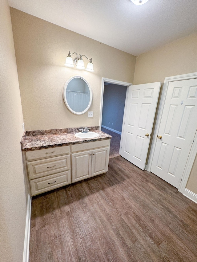 bathroom featuring wood-type flooring and vanity