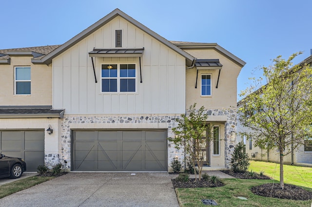 view of front of property with a front lawn and a garage