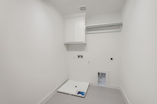 laundry area with cabinets, hookup for a washing machine, light tile patterned flooring, hookup for a gas dryer, and hookup for an electric dryer