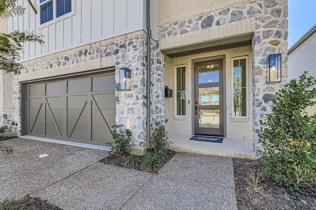 view of exterior entry with a garage