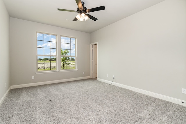 empty room featuring ceiling fan and carpet flooring