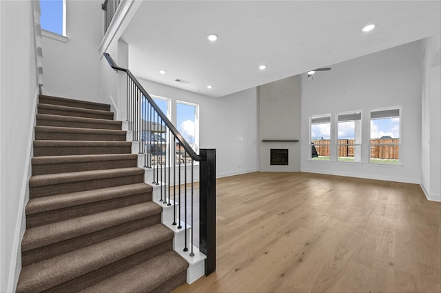 stairway featuring wood-type flooring