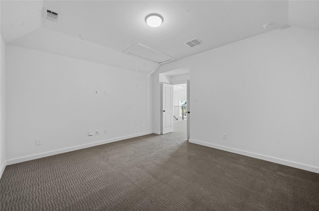 carpeted empty room with lofted ceiling