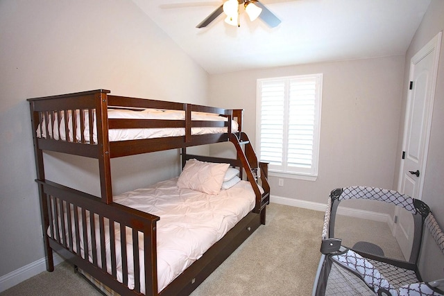 bedroom featuring ceiling fan, carpet floors, and vaulted ceiling