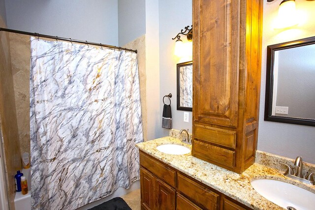 bathroom featuring vanity and shower / tub combo