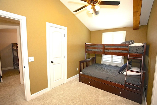 carpeted bedroom featuring ceiling fan and vaulted ceiling