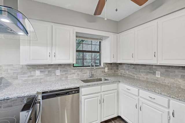 kitchen with white cabinetry, backsplash, sink, dishwasher, and ceiling fan