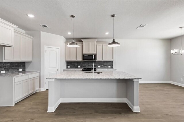 unfurnished living room featuring a brick fireplace, light hardwood / wood-style floors, high vaulted ceiling, and ceiling fan