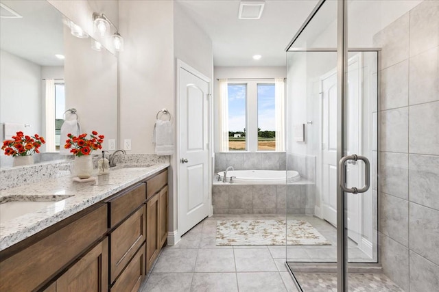 bathroom with vanity, tile patterned floors, and independent shower and bath