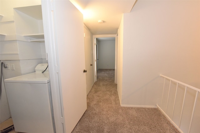 washroom featuring light carpet and washer / dryer