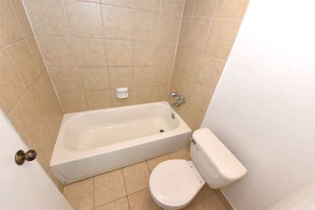 bathroom with shower / washtub combination, tile floors, and toilet