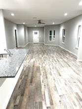 empty room featuring sink and hardwood / wood-style flooring