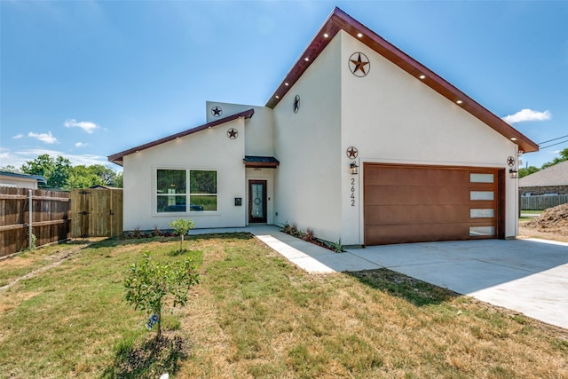 view of front facade featuring a garage and a front lawn