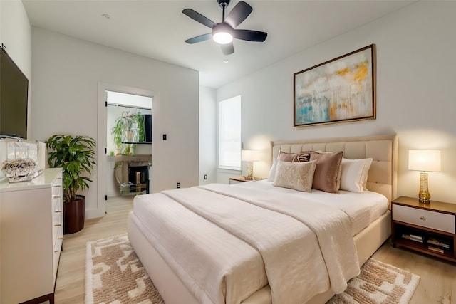 bedroom with ceiling fan and light hardwood / wood-style flooring