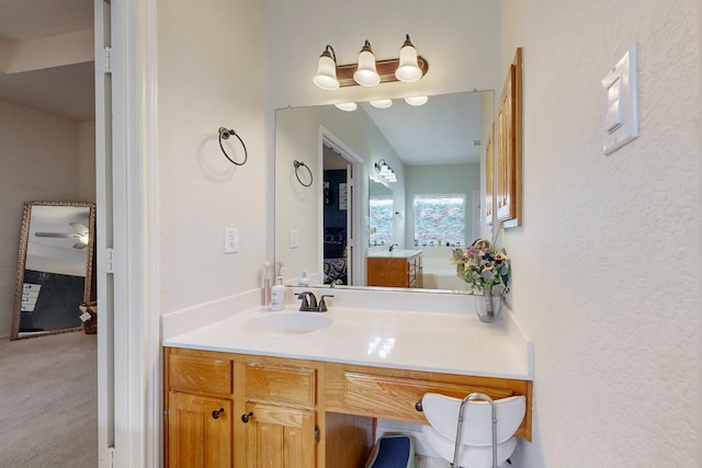 bathroom featuring vanity and ceiling fan