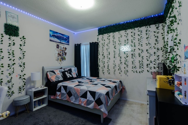 bedroom with a textured ceiling and carpet floors