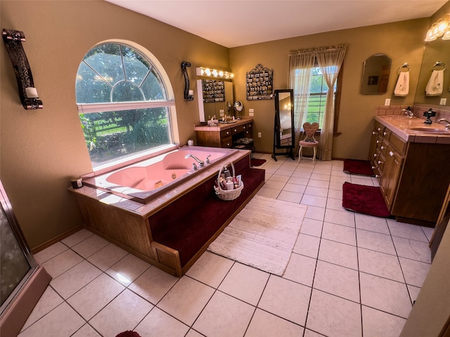 interior space featuring a washtub, vanity, and tile floors