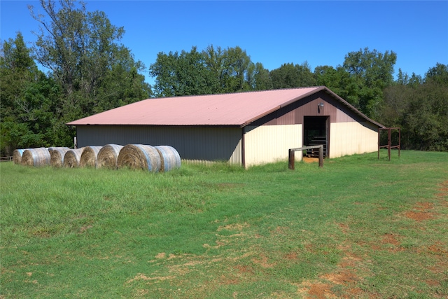 exterior space featuring a yard and an outdoor structure