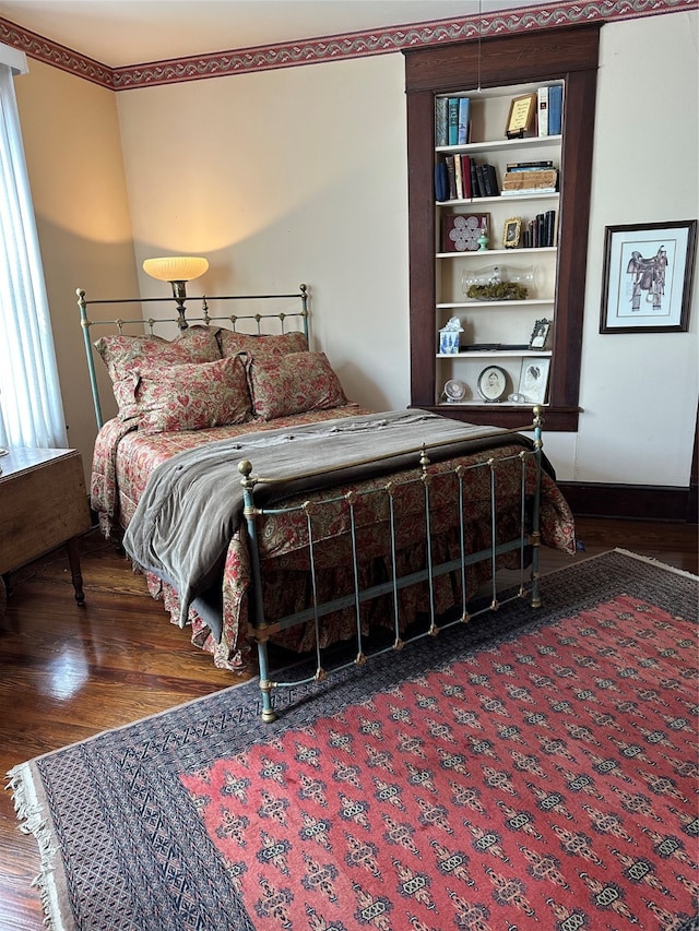 bedroom featuring dark hardwood / wood-style floors