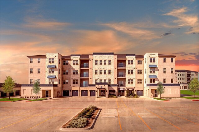 view of outdoor building at dusk