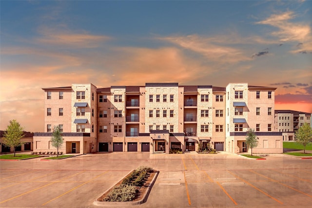 view of outdoor building at dusk