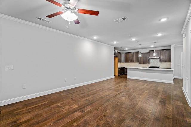 unfurnished living room with ceiling fan, ornamental molding, and dark hardwood / wood-style flooring