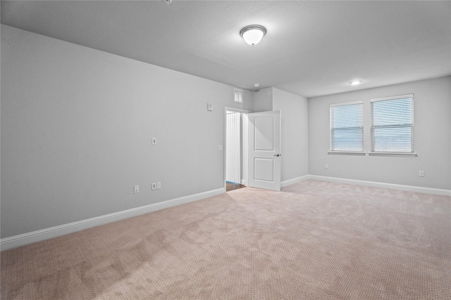 unfurnished bedroom with light colored carpet