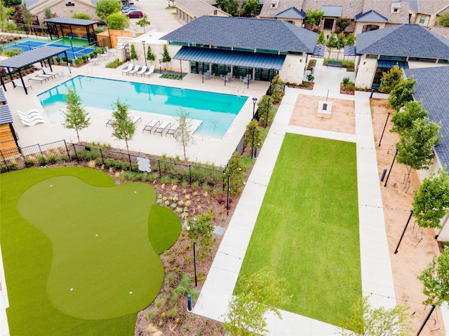 view of pool featuring exterior bar and a patio area