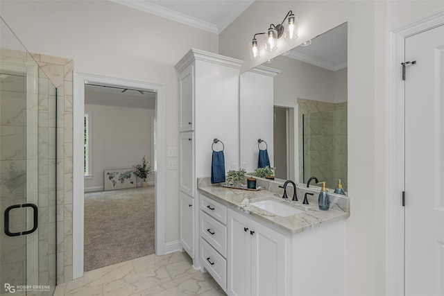 bathroom with walk in shower, ornamental molding, and vanity