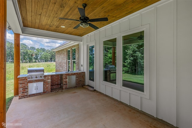 view of patio featuring grilling area, ceiling fan, sink, and exterior kitchen