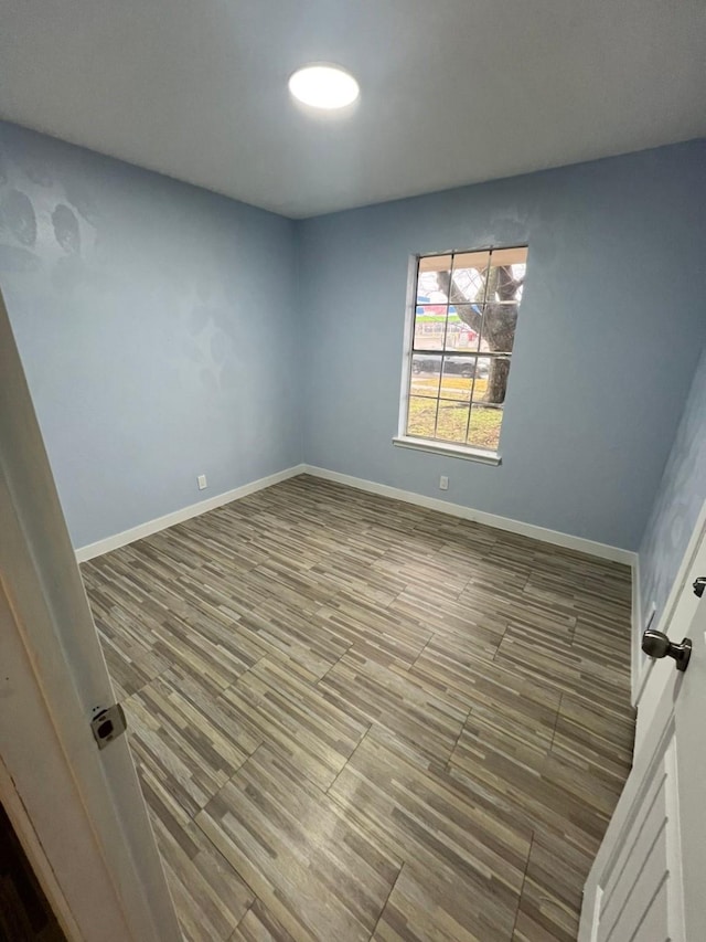 empty room featuring hardwood / wood-style flooring