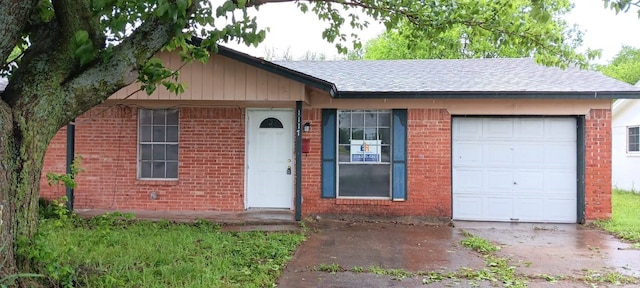 ranch-style house featuring a garage