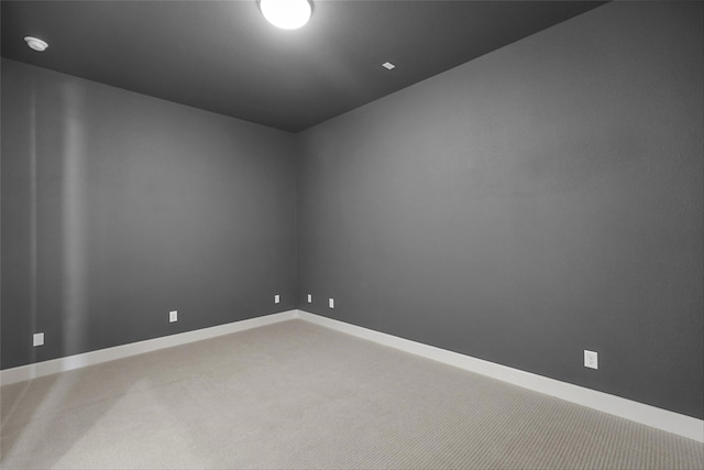 empty room featuring carpet flooring