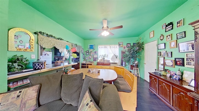 interior space featuring lofted ceiling and ceiling fan