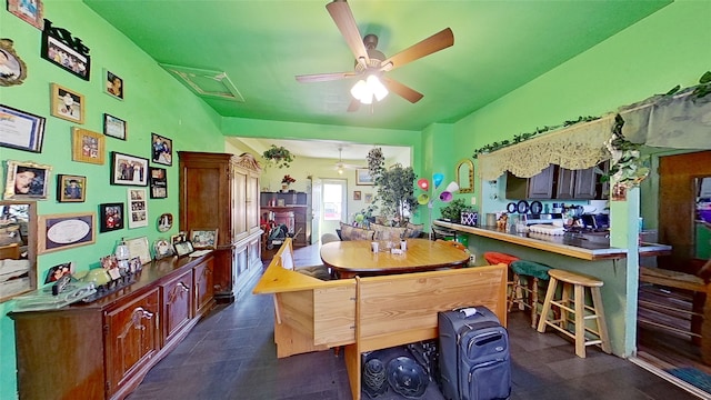 interior space with ceiling fan