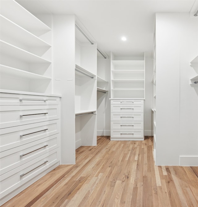 walk in closet featuring light hardwood / wood-style flooring