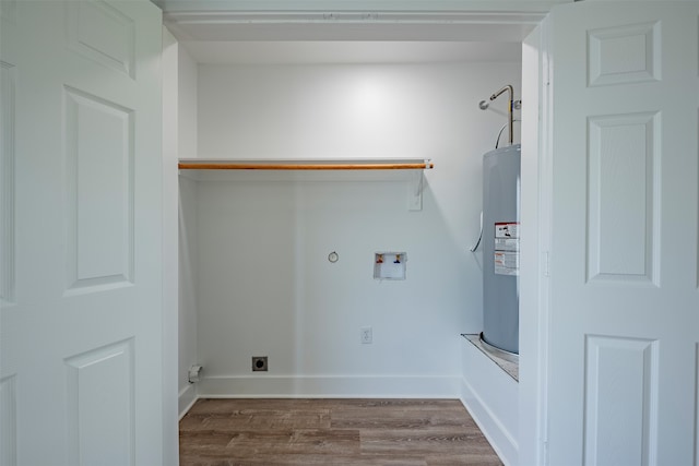 clothes washing area featuring hardwood / wood-style flooring, hookup for a washing machine, water heater, and hookup for an electric dryer