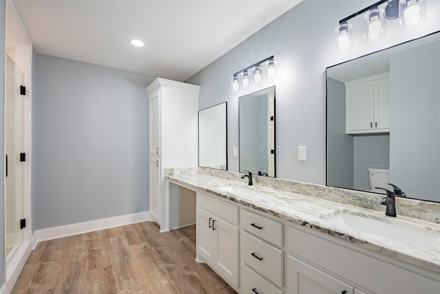 bathroom featuring hardwood / wood-style floors and vanity