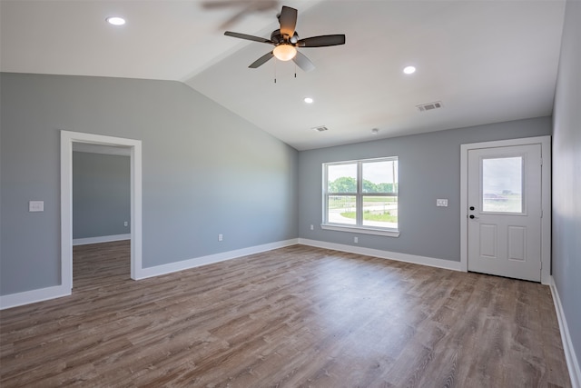 unfurnished living room with light hardwood / wood-style floors, ceiling fan, and lofted ceiling