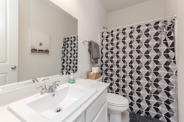 bathroom with vanity and toilet