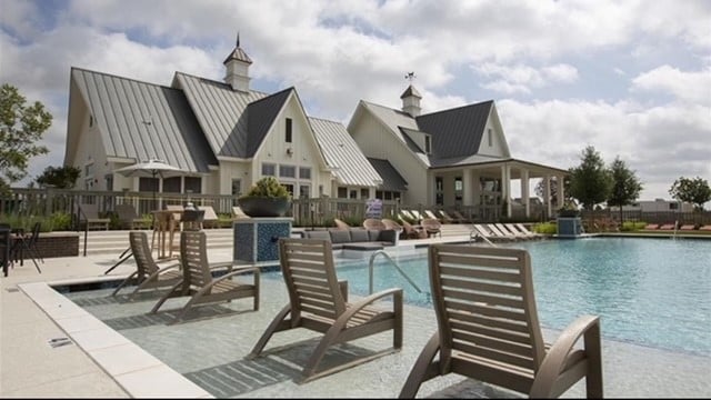 view of pool featuring a patio area and pool water feature