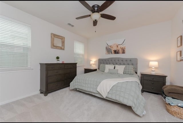 carpeted bedroom featuring ceiling fan