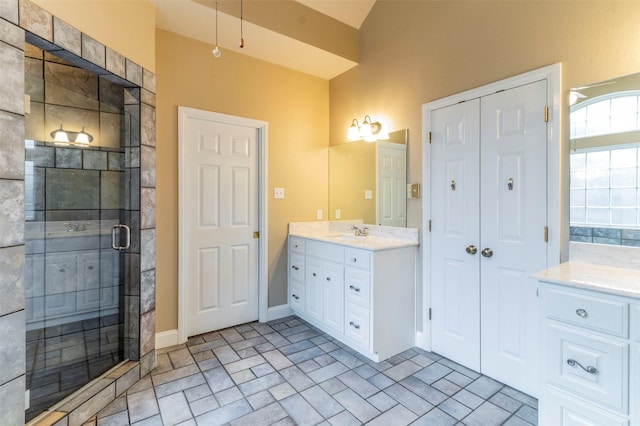 bathroom featuring vanity and an enclosed shower