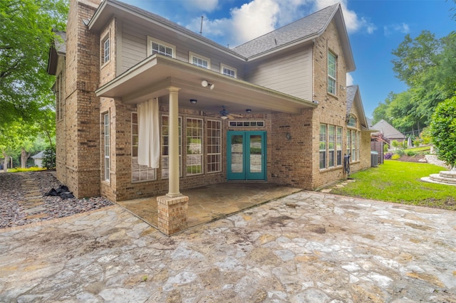 exterior space featuring french doors, a patio area, and central air condition unit