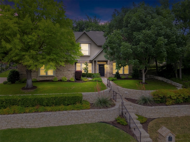 view of front of property with a yard