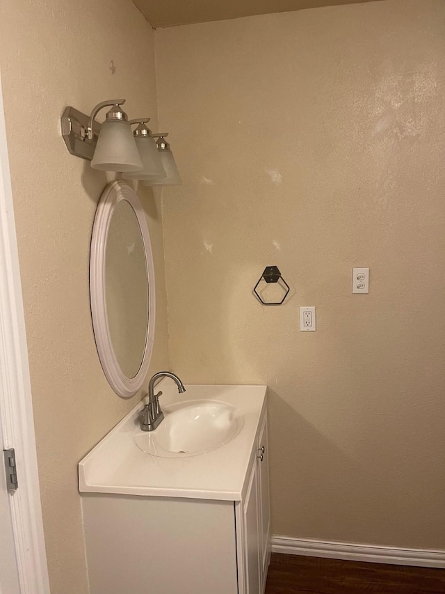 bathroom featuring hardwood / wood-style floors and vanity