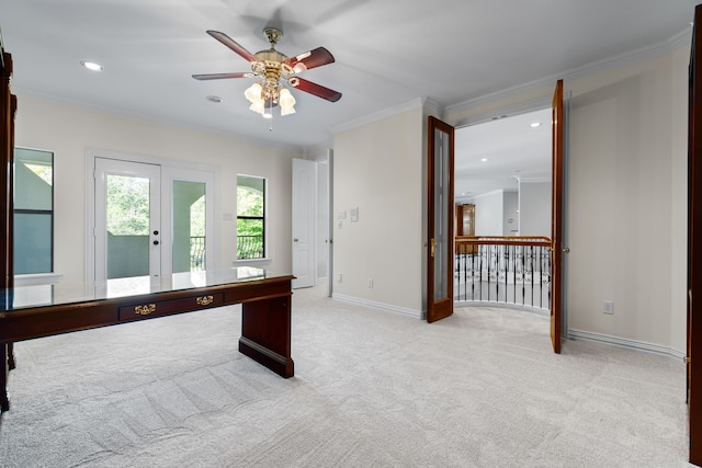 unfurnished office with light carpet, ceiling fan, crown molding, and french doors