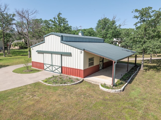 exterior space featuring a lawn and a carport